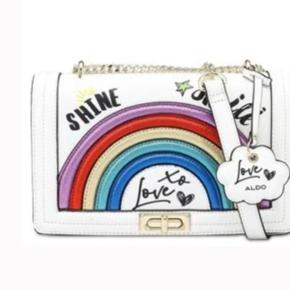 This is an Aldo Grelaswen satchel handbag in white with a rainbow and "Love"